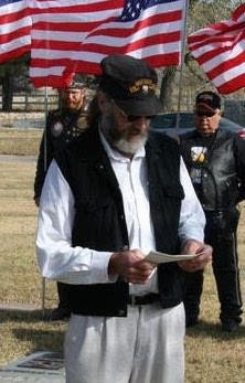 Chuck ‘Doc’ Heyn reading an elegy for Fred Tomlin, a fellow medic, during a memorial service in Hutchinson, KS on November 10, 2007.
